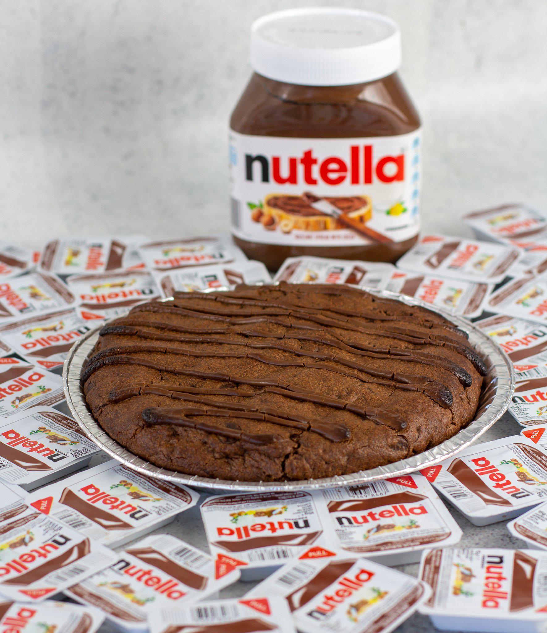 https://biggandthicc.com.au/cdn/shop/products/1kg-Tella-Cookie-w-Nutella-THICC-New-York-Style-Cookies-BIGG-Brownies-3.jpg?v=1673943784&width=1946